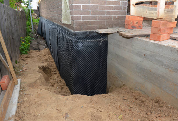 Happy homeowners after waterproofing job in Custer